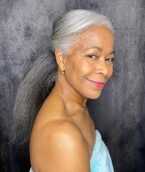 Mature woman with long gray hair portrait